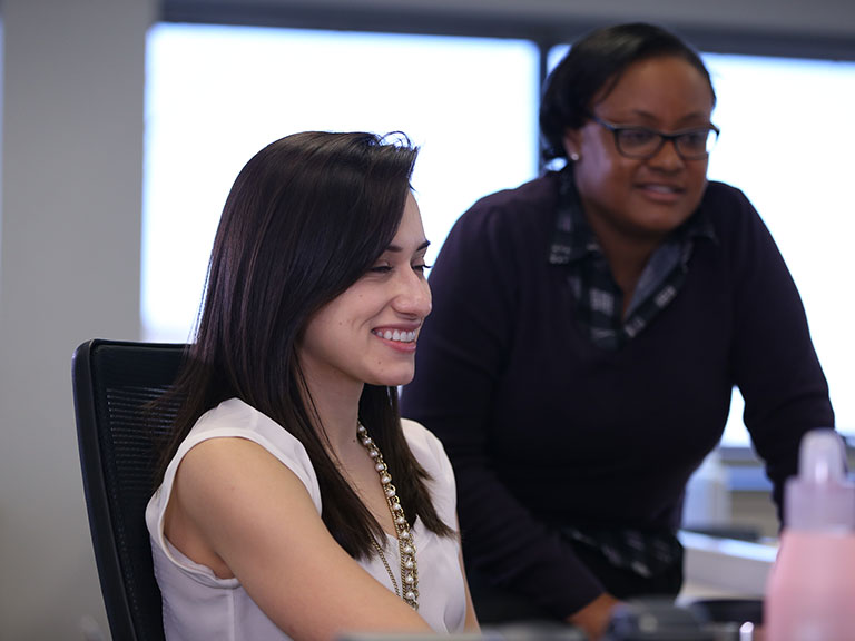 Two women working in office
